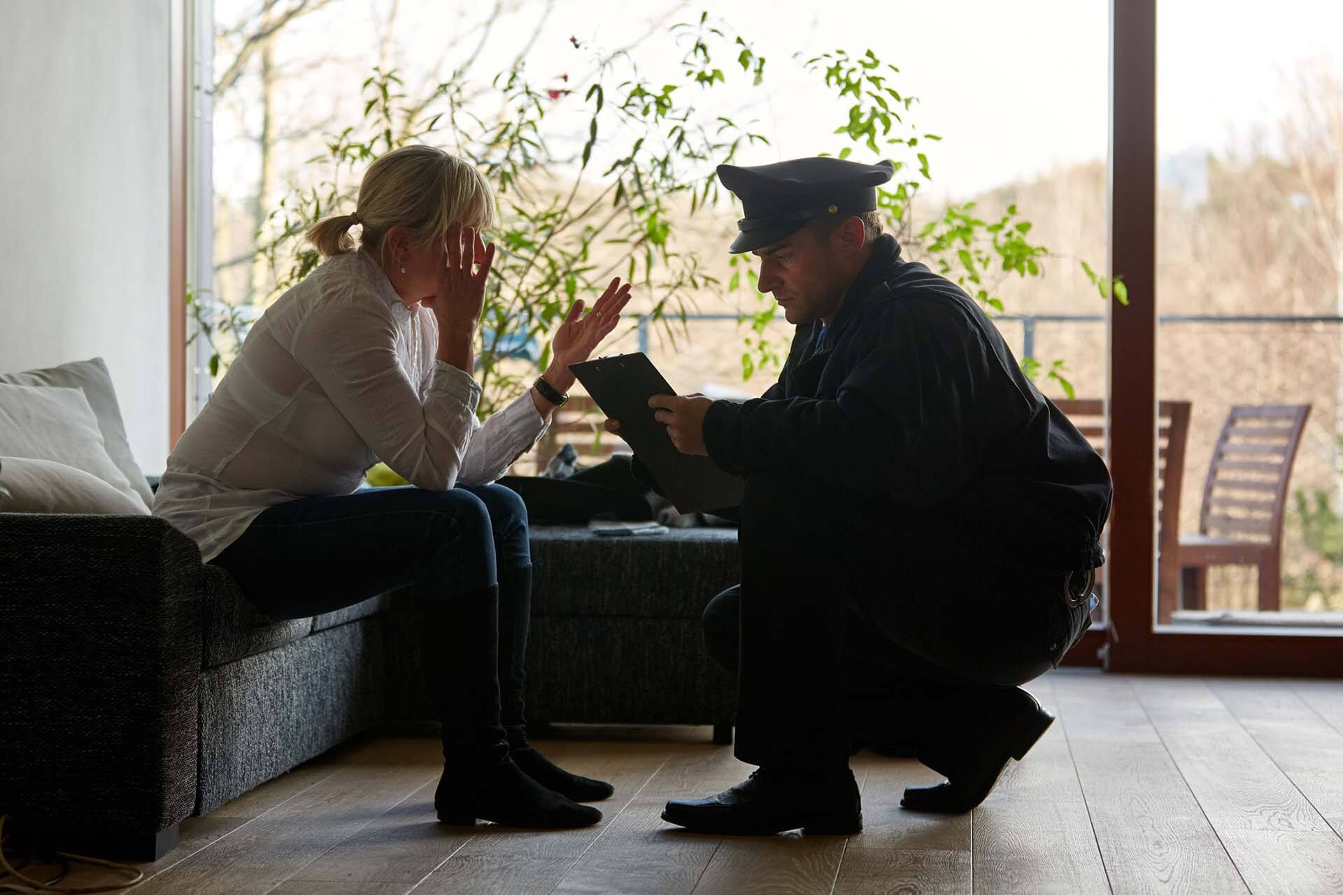 Policeman Interviewing Woman