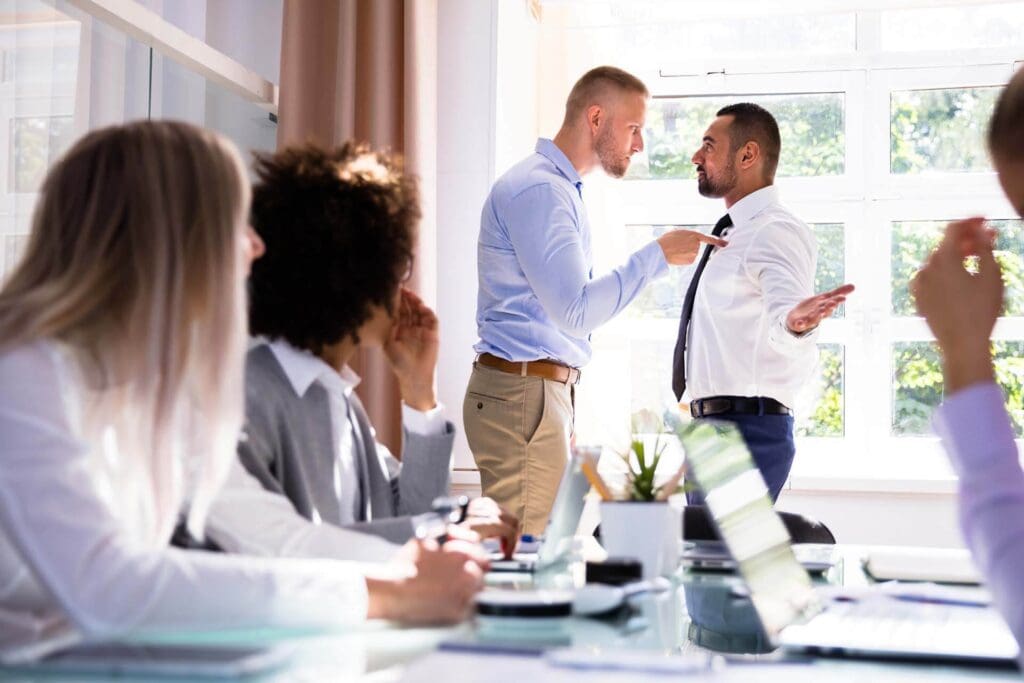 Man Pointing At Another Man Aggressively