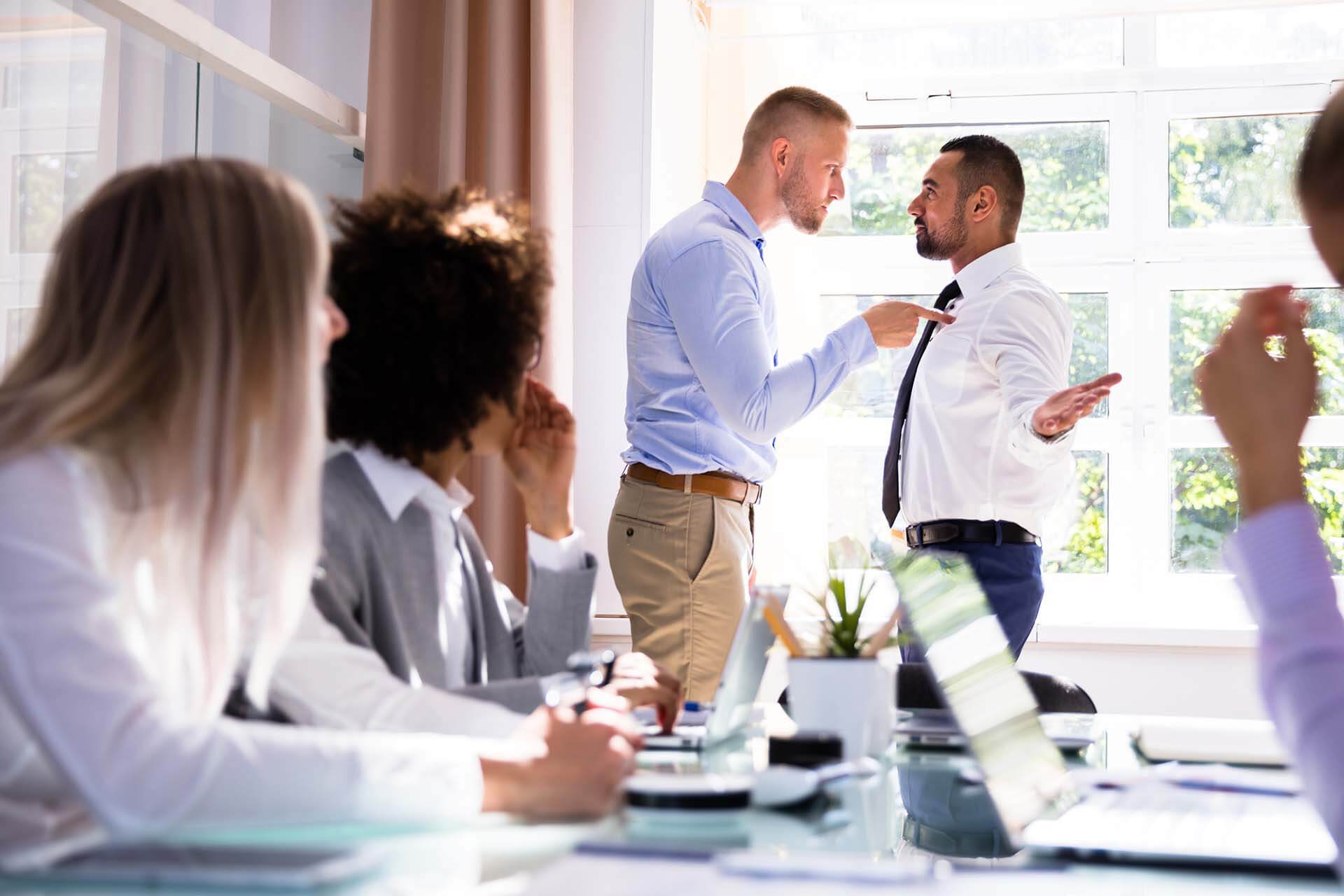 Man Pointing At Another Man Aggressively