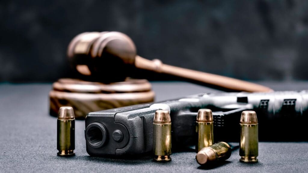 Gavel, Gun, and Bullet Casings Representing Legal Issues