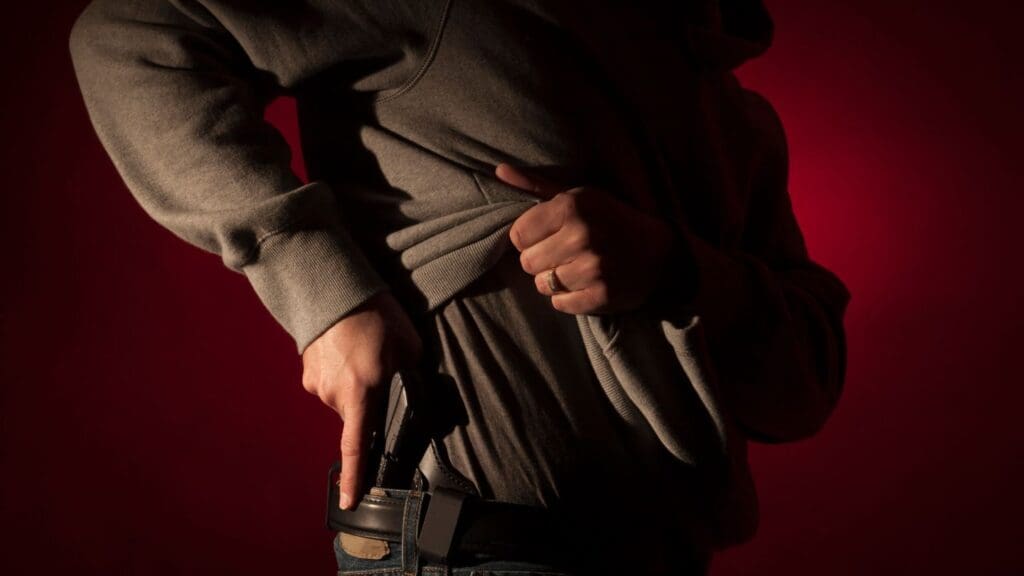 Person Concealing a Gun in a Holster